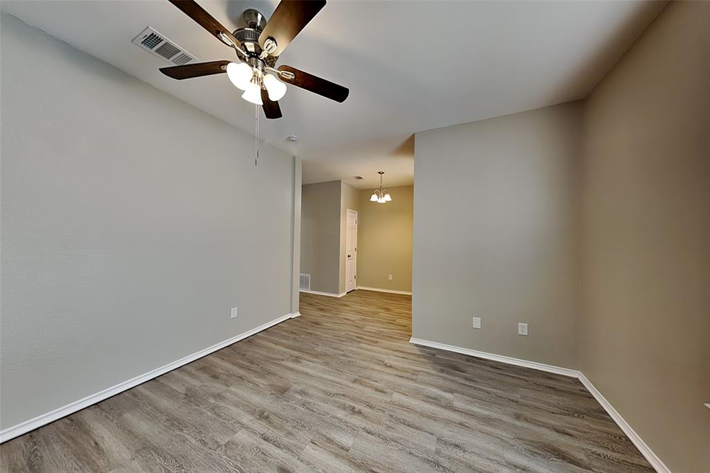 1056 Pullman Drive Saginaw, TX 76131 - Photo 5 of 27 wooden floor in an empty room