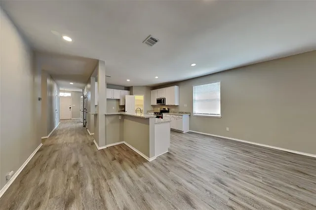 a view of kitchen with wooden floor