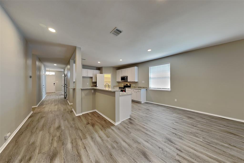 1056 Pullman Drive Saginaw, TX 76131 - Photo 6 of 27 a view of kitchen with wooden floor