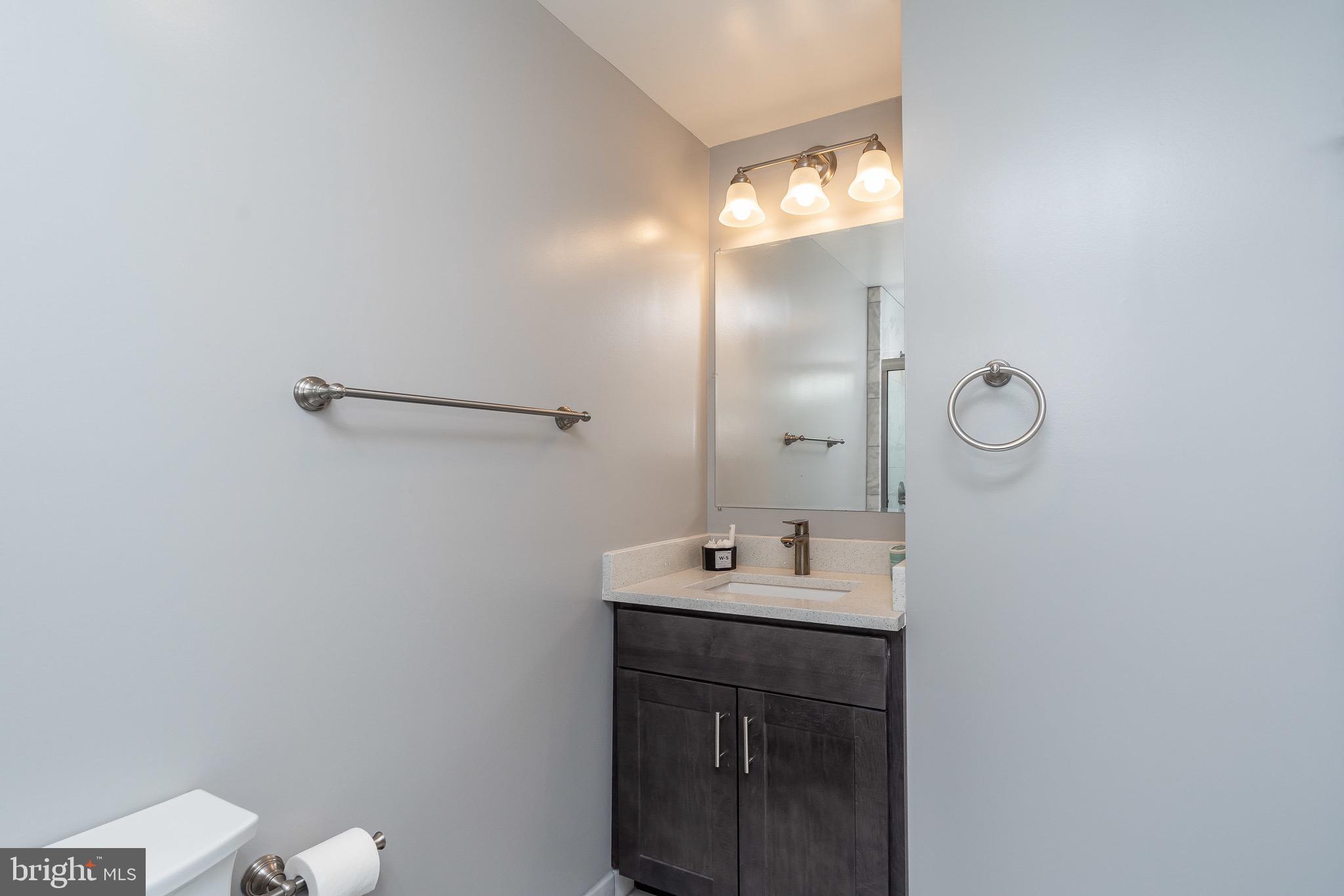 365 Bonsal Street Baltimore, MD 21224 - Photo 18 of 36 a bathroom with a sink and a mirror