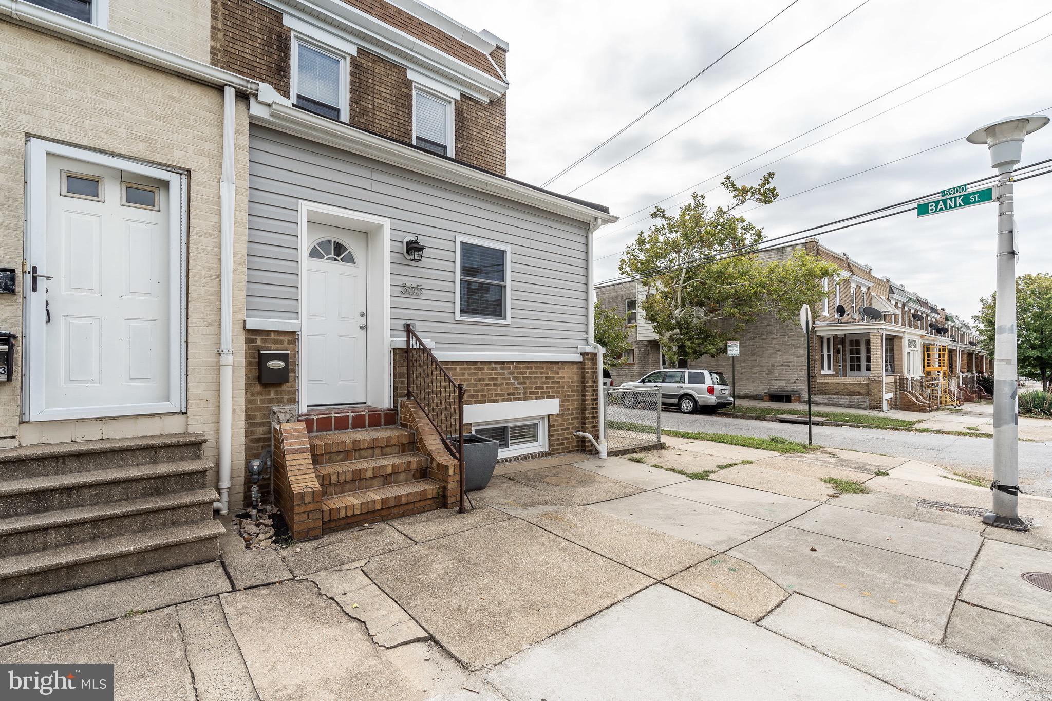 365 Bonsal Street Baltimore, MD 21224 - Photo 2 of 36 a view of a house with a barbeque and bench
