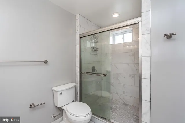 a bathroom with double vanity sinks and a mirror