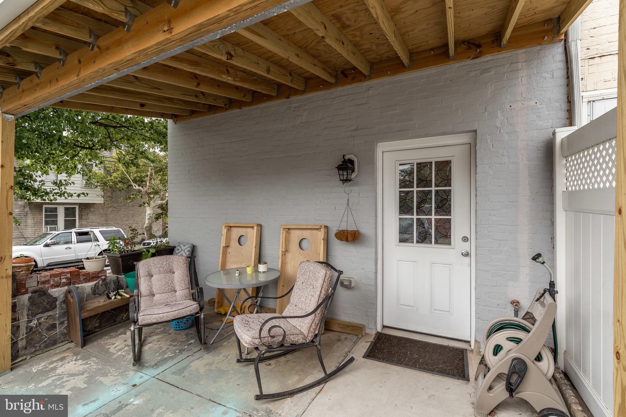 365 Bonsal Street Baltimore, MD 21224 - Photo 29 of 36 a roof deck with table and chairs and potted plants