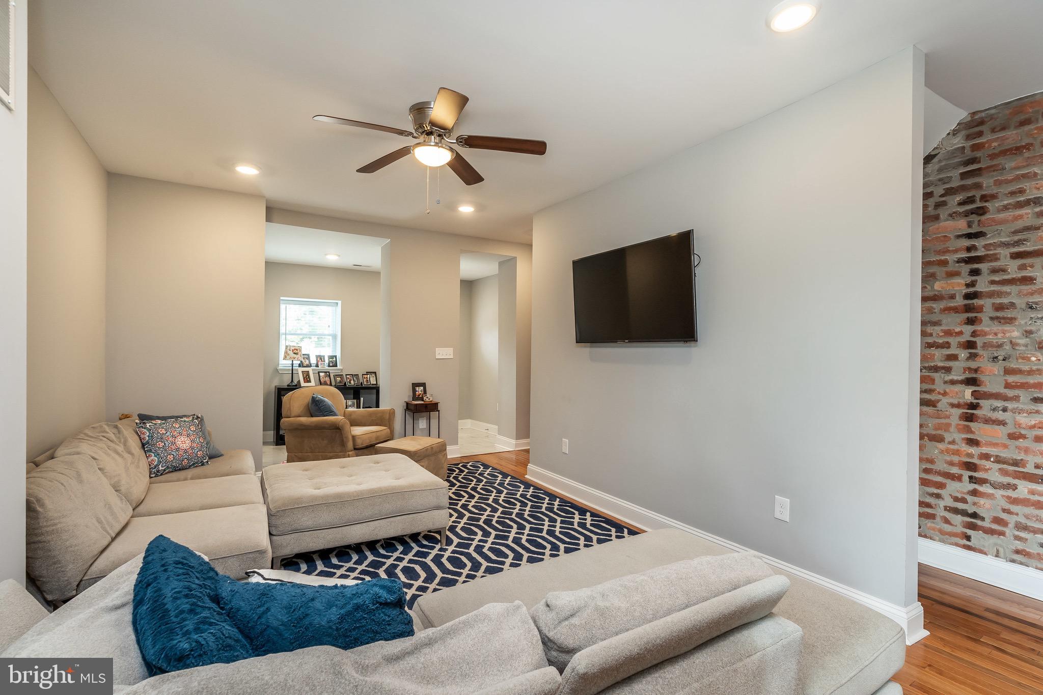 365 Bonsal Street Baltimore, MD 21224 - Photo 4 of 36 a living room with furniture and a flat screen tv