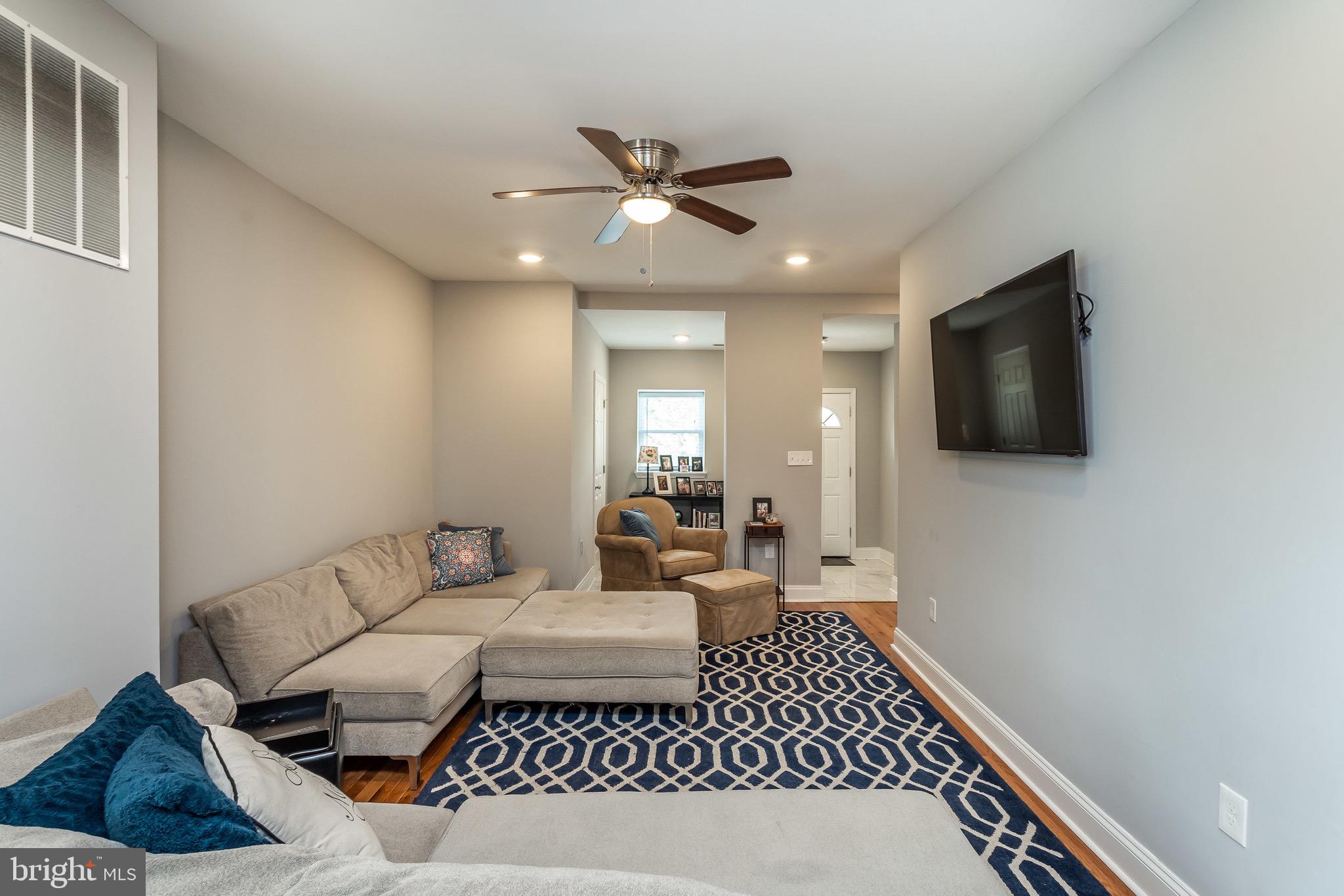 365 Bonsal Street Baltimore, MD 21224 - Photo 5 of 36 a living room with furniture and a flat screen tv