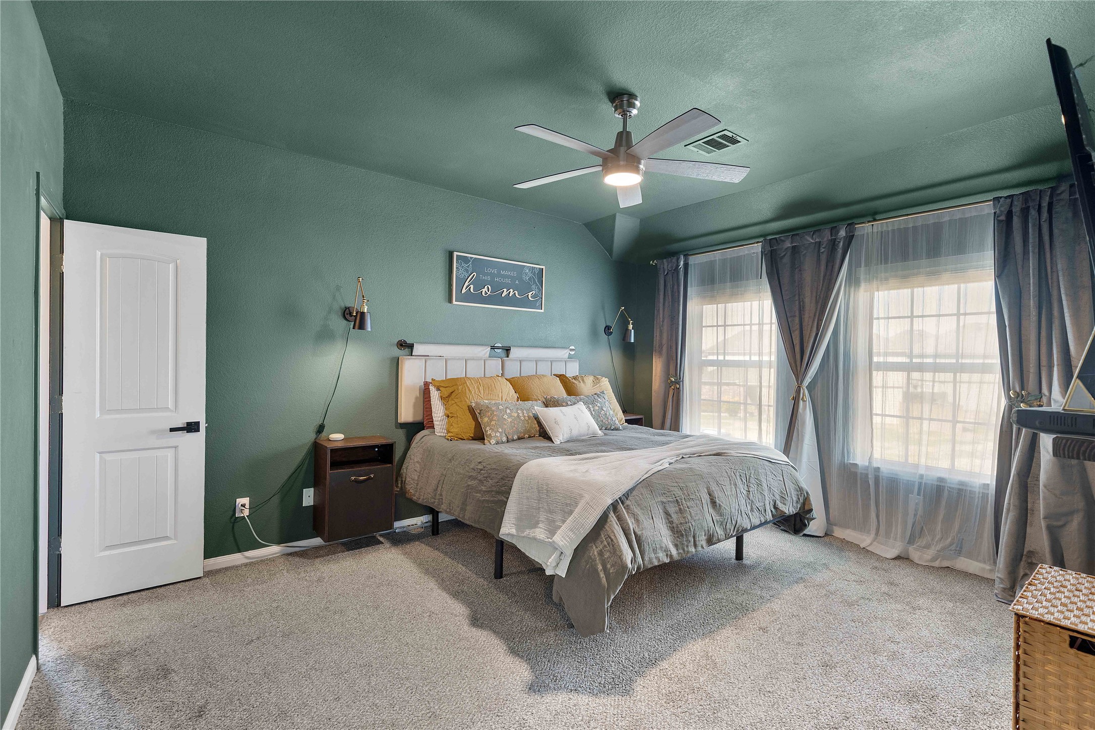 18623 Jerrara Stream Lane Katy, TX 77449 - Photo 19 of 46 The large primary bedroom has been color drenched in a rich, forest green. Extra lighting has been added as well as floating bedside tables with tons of storage.