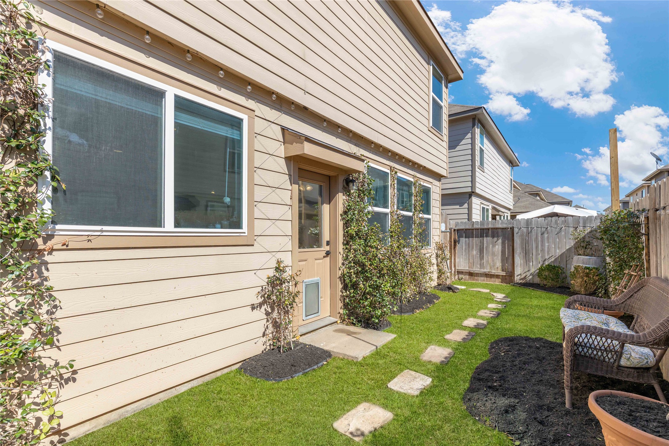 18623 Jerrara Stream Lane Katy, TX 77449 - Photo 31 of 46 Have your dogs let themselves out right off of the kitchen into their private backyard. Photo has been digitally altered to show fully grown grass. Ground has been seeded and recently landscaped - ready for move-in.