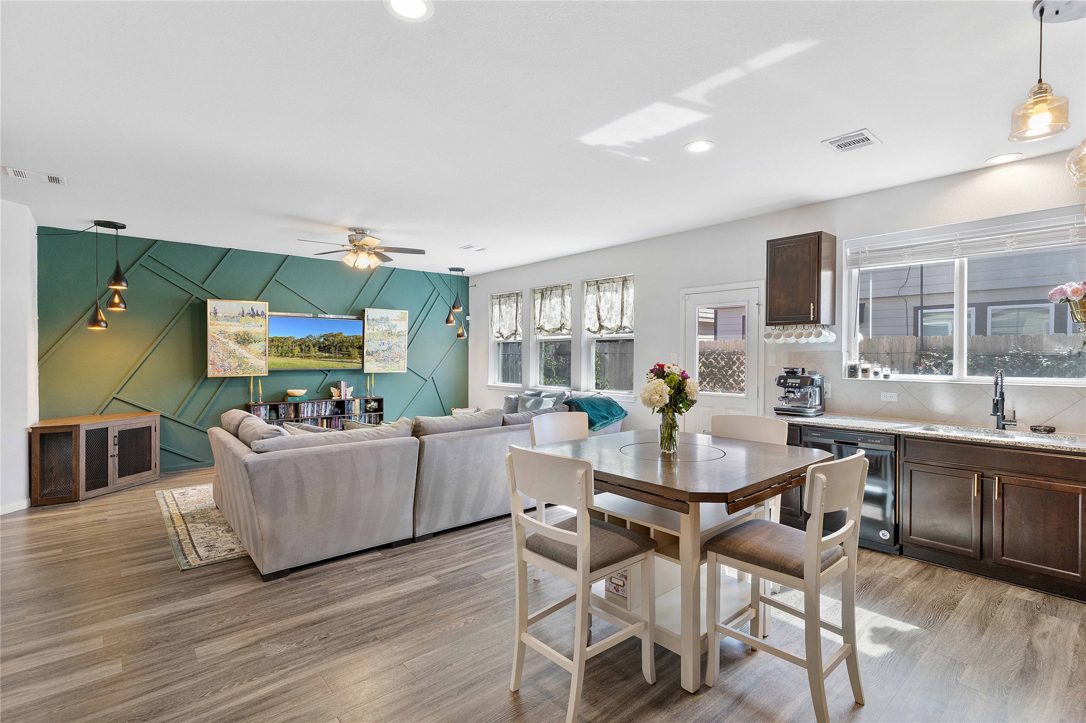 18623 Jerrara Stream Lane Katy, TX 77449 - Photo 46 of 46 Host guests while they relax with this open floor plan on the first floor! Natural light beams in through the kitchen windows. Wash your glasses with the automatic washer nestled at the kitchen sink.