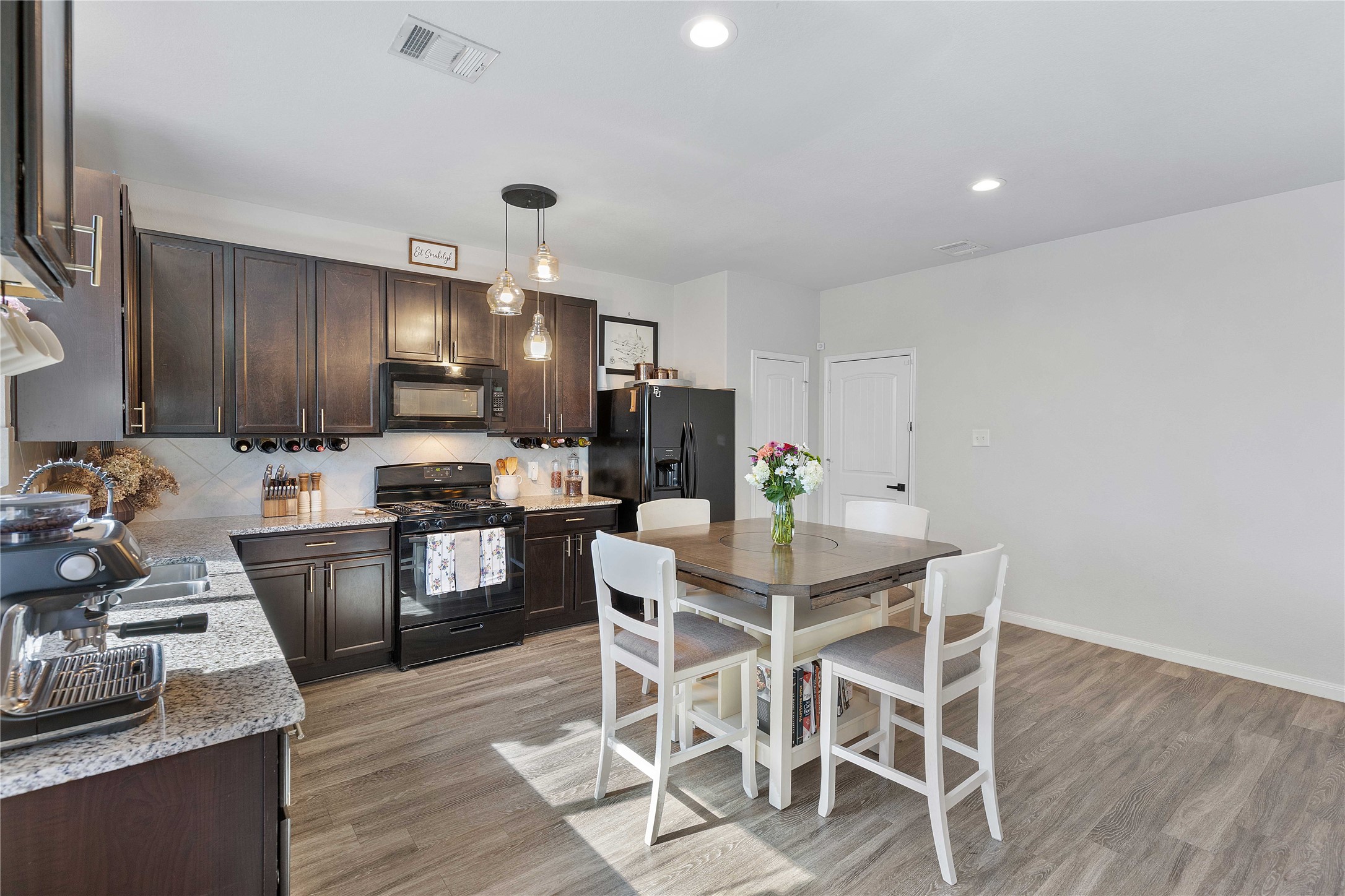 18623 Jerrara Stream Lane Katy, TX 77449 - Photo 5 of 46 There is lots of storage in the modern kitchen cabinets AND room in the kitchen for an additional bar area or coffee bar.