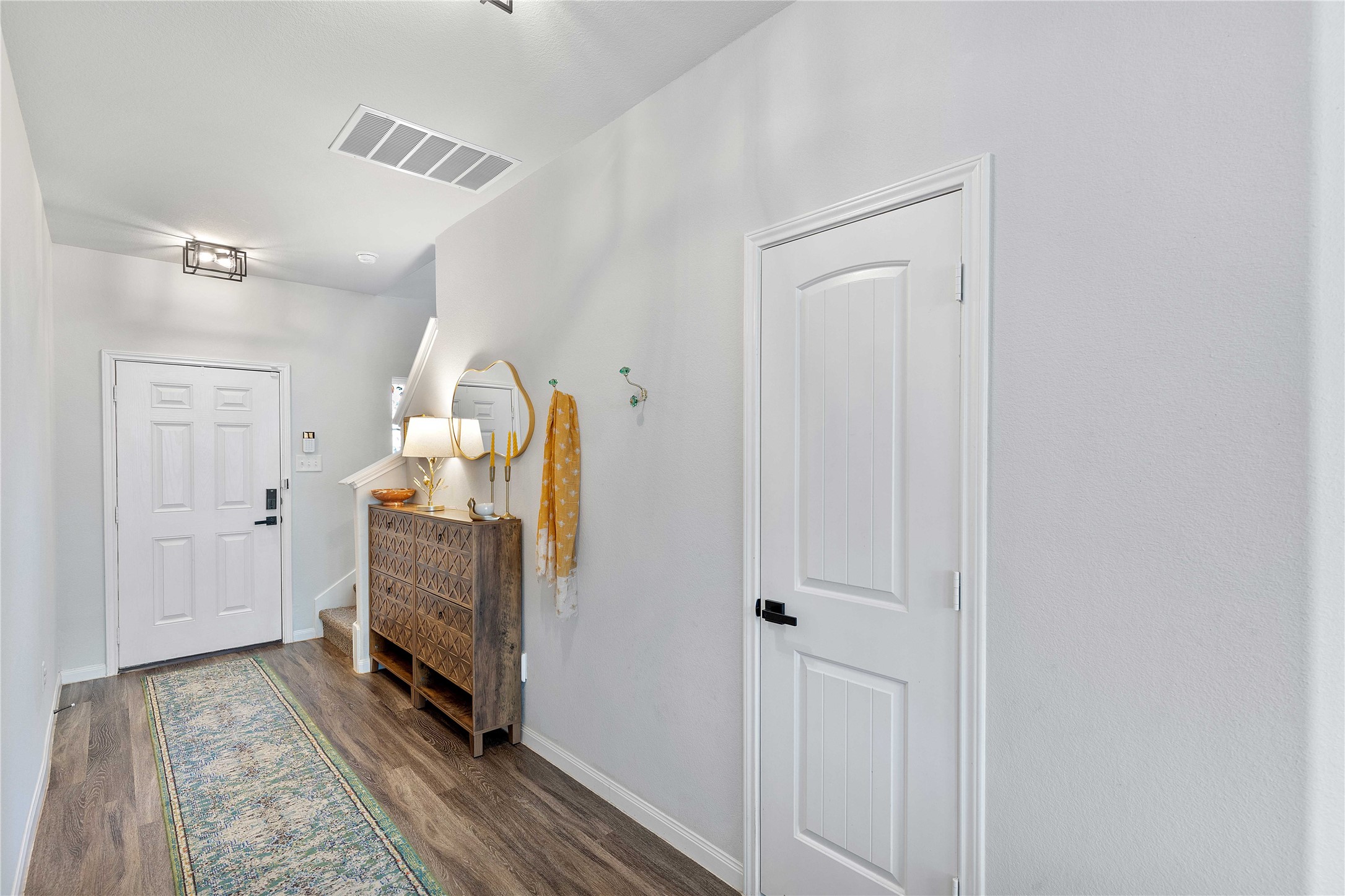 18623 Jerrara Stream Lane Katy, TX 77449 - Photo 9 of 46 A long, open entry way hall greets guests from the front door all the way through.