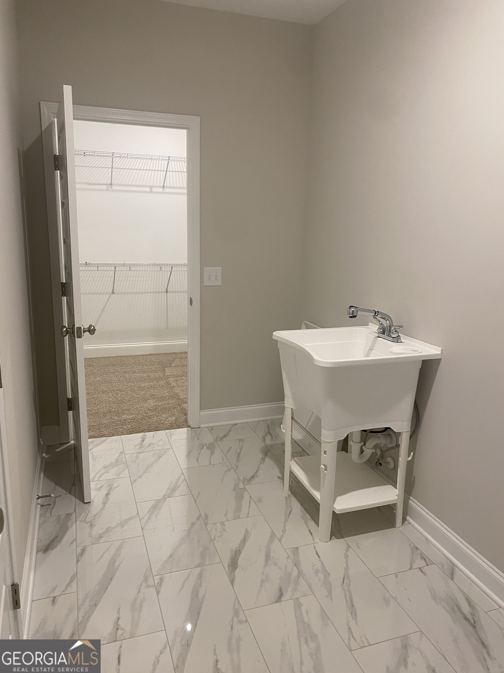 296 Delightful Way, Unit 22 Winder, GA 30680 - Photo 10 of 13 a bathroom with a sink toilet and shower