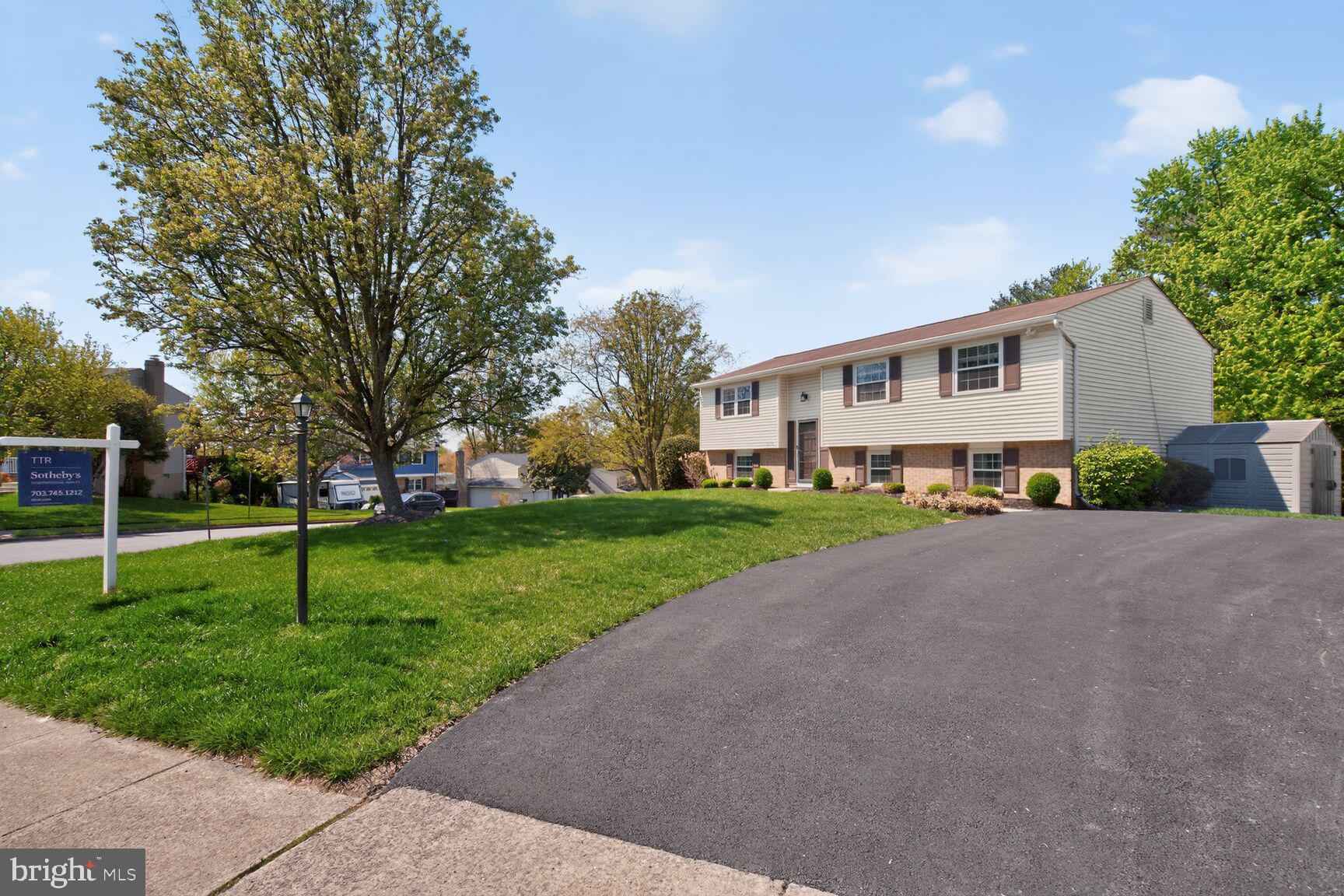 2806 Logway Road Vienna, VA 22181 - Photo 2 of 33 a front view of a house with a yard and trees