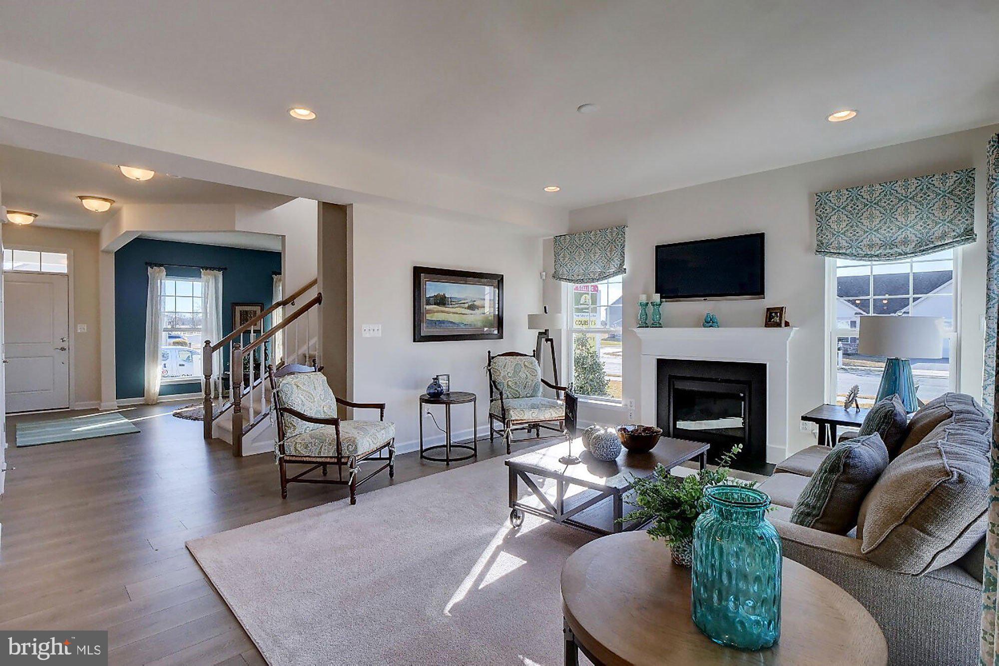 1546 Shipsview Road Annapolis, MD 21409 - Photo 6 of 13 a living room with furniture and a fireplace
