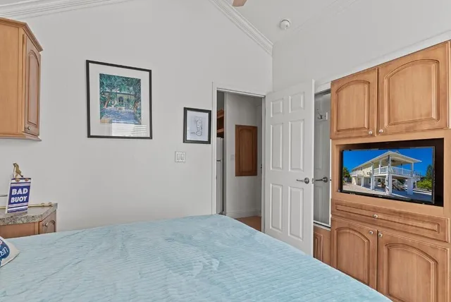 a bedroom with a large bed and a window