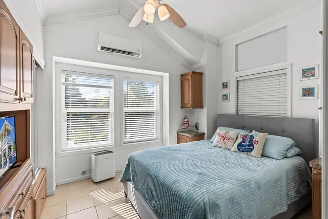 a bedroom with a bed and dresser