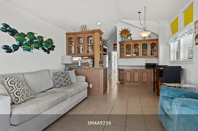 a view of a kitchen with stainless steel appliances granite countertop a stove and a sink