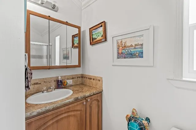 a white toilet sitting next to a bathroom sink