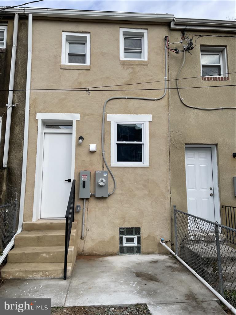 1509 Lemmon Street Baltimore, MD 21223 - Photo 12 of 14 a front view of a house with a door