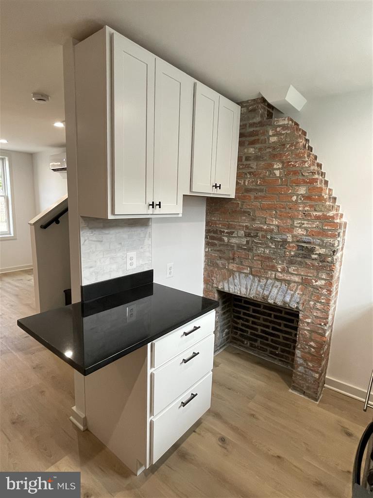 1509 Lemmon Street Baltimore, MD 21223 - Photo 4 of 14 a kitchen with cabinets and appliances
