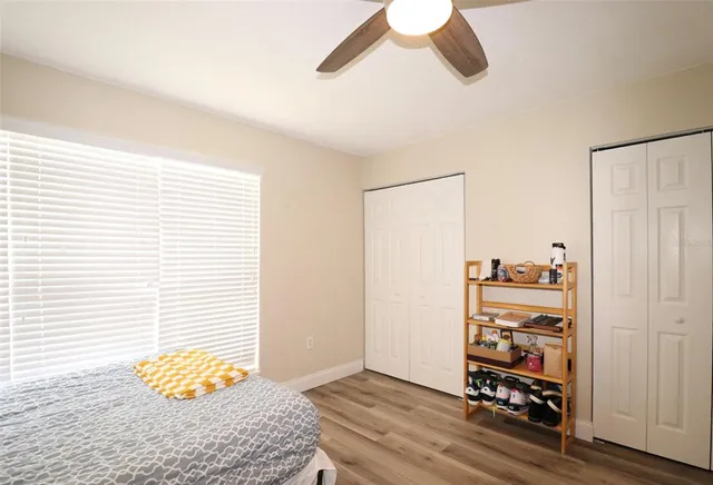 a view of room with wooden floor and closet