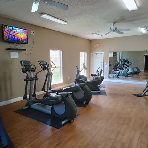 a room with gym equipment and a large window