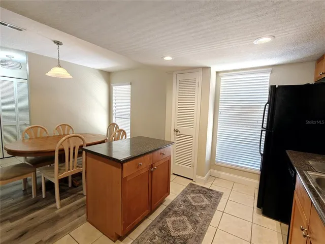 a bathroom with a sink a mirror and a shower