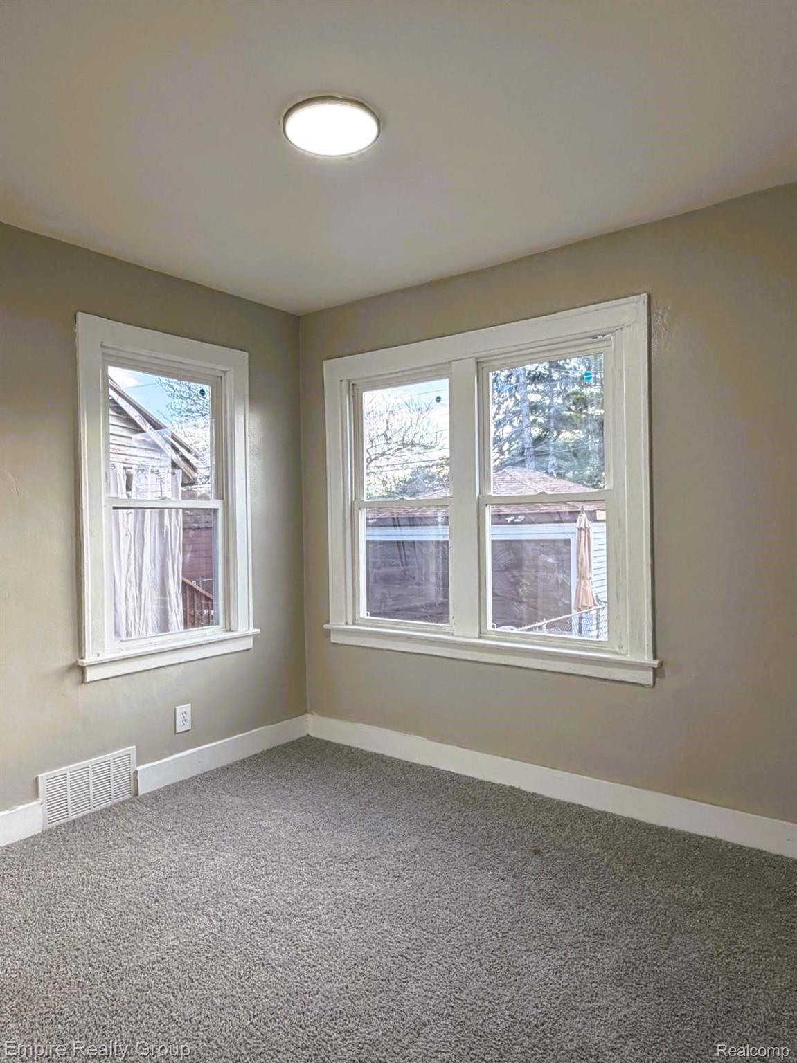 6441 Appoline Street, Unit 1 Dearborn, MI 48126 - Photo 12 of 13 Spare room with baseboards and carpet