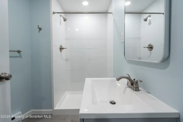a bathroom with a toilet and a sink