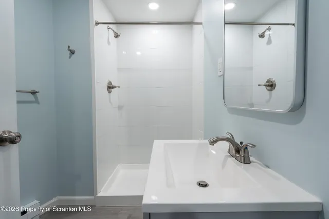 a bathroom with a toilet and a sink