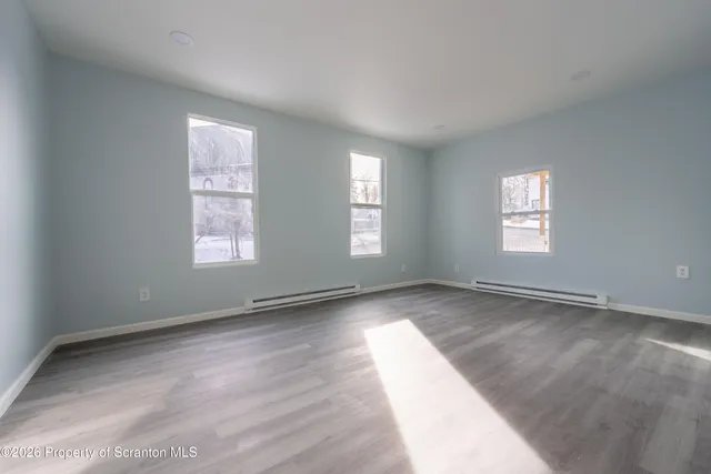 a view of an empty room and window