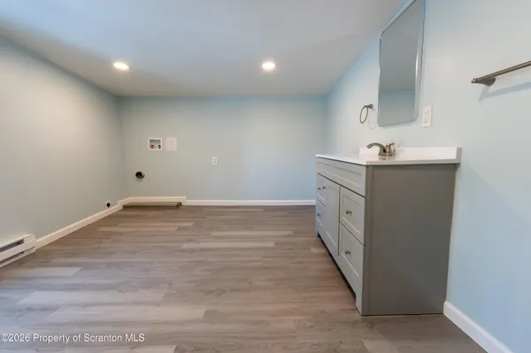 a white toilet sitting next to a bathroom sink