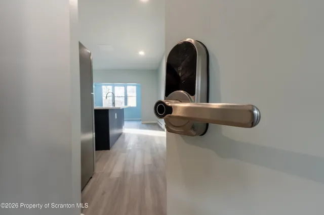 a kitchen with stainless steel appliances granite countertop a sink a stove top oven a counter space and cabinets