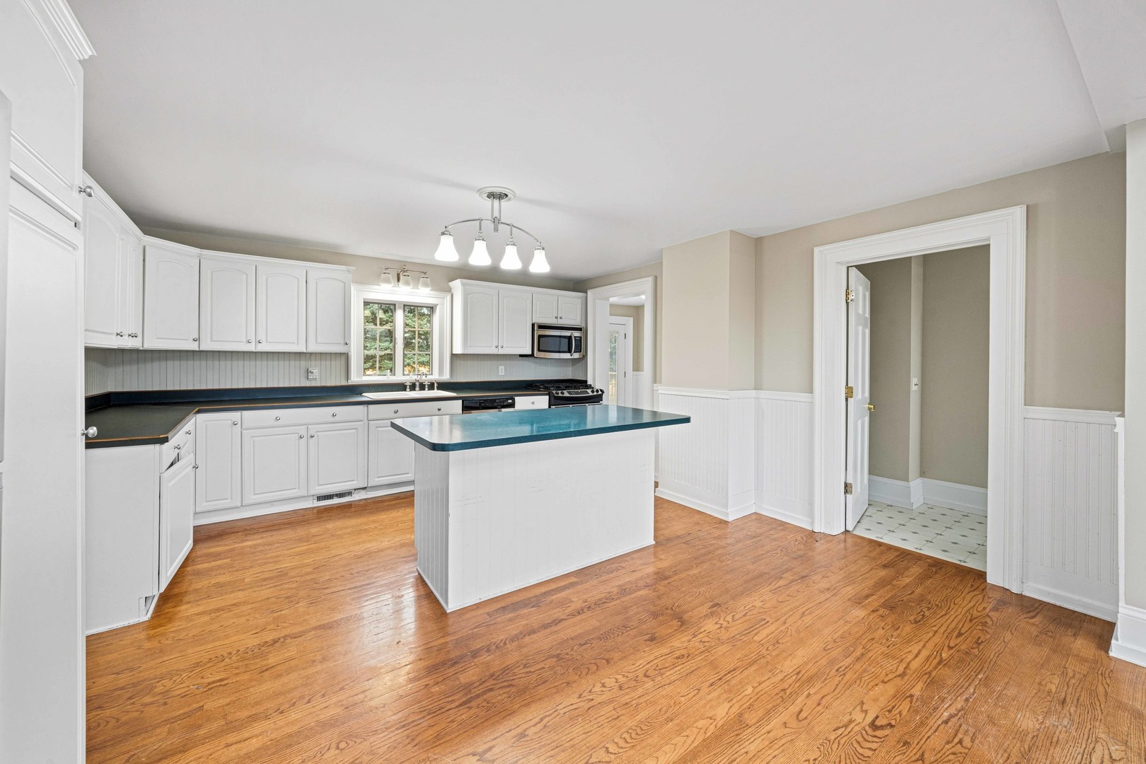 16645 Lasher Road Hinckley, IL 60520 - Photo 11 of 80 a kitchen with granite countertop a stove top oven a sink a counter space and cabinets