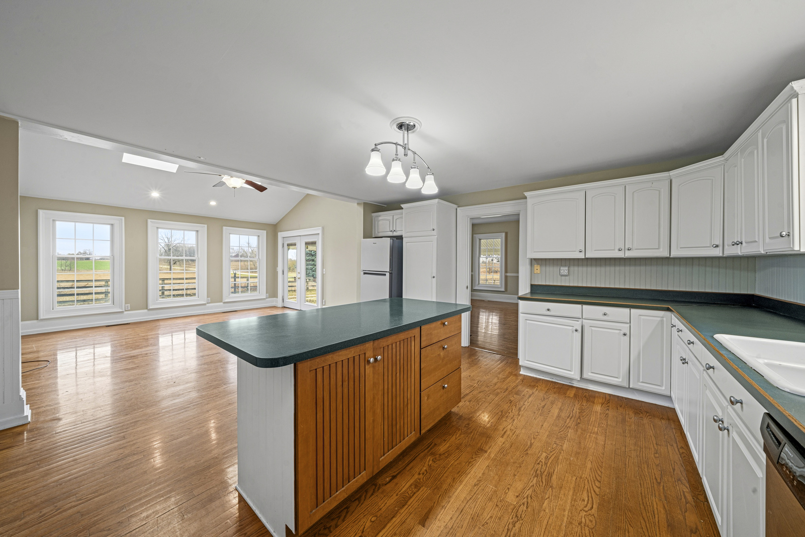 16645 Lasher Road Hinckley, IL 60520 - Photo 13 of 80 a large kitchen with stainless steel appliances granite countertop a stove and a sink with cabinets