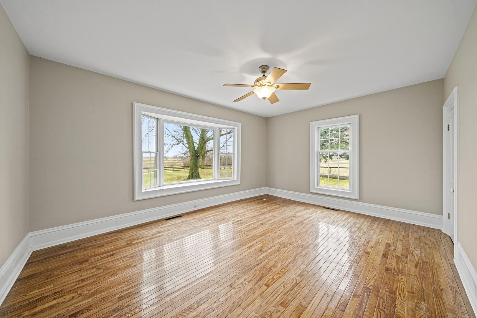 16645 Lasher Road Hinckley, IL 60520 - Photo 17 of 80 a view of an empty room with a window and wooden floor