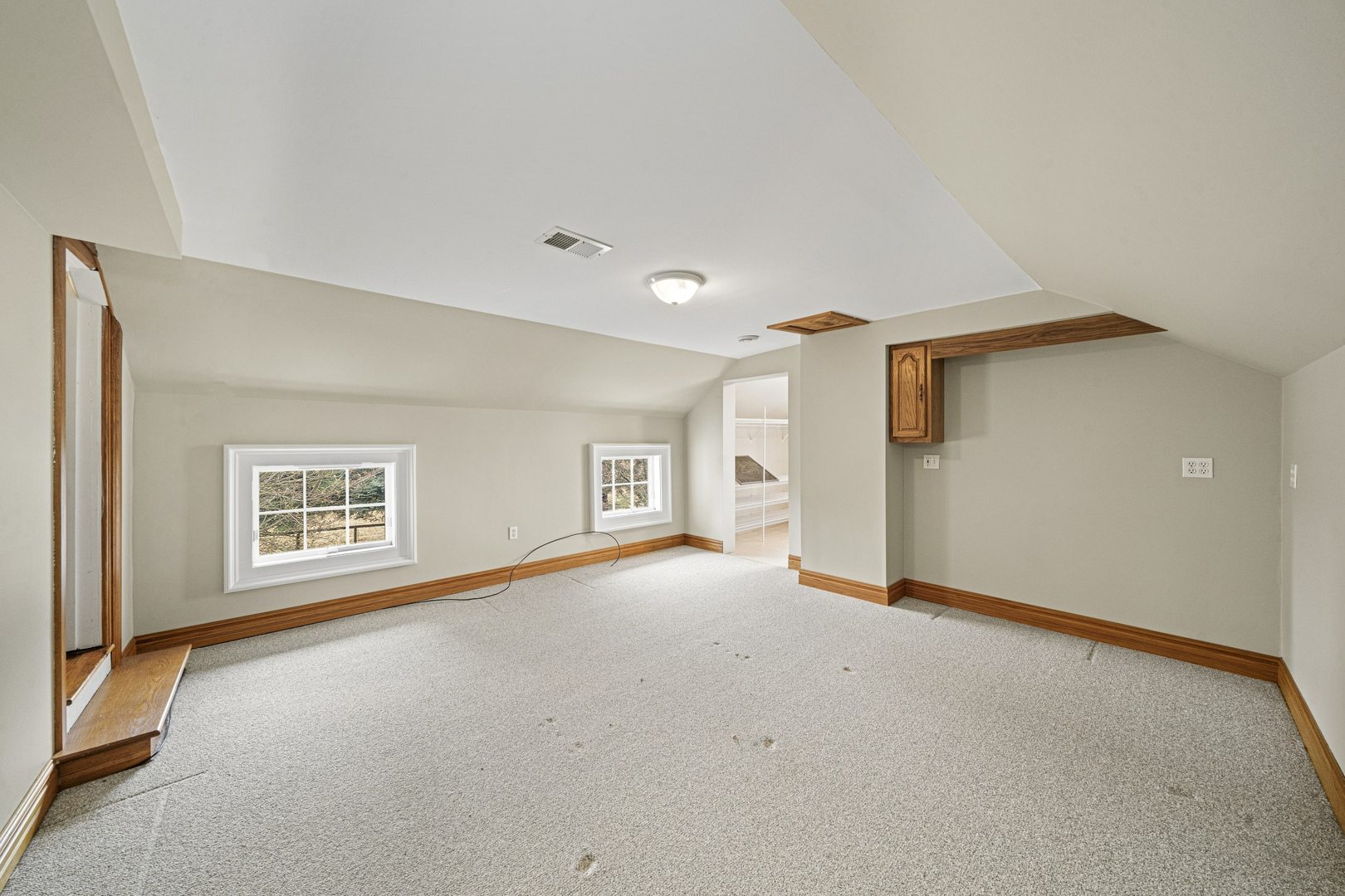 16645 Lasher Road Hinckley, IL 60520 - Photo 23 of 80 a view of a big room with windows and chandelier fan