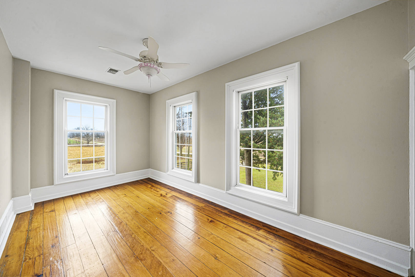 16645 Lasher Road Hinckley, IL 60520 - Photo 28 of 80 a view of an empty room with a window and wooden floor