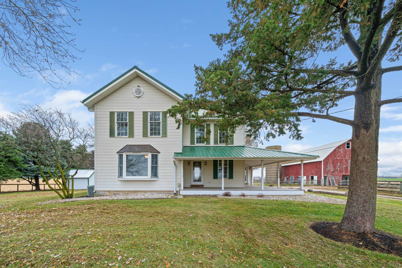 16645 Lasher Road Hinckley, IL 60520 - Photo 4 of 80 a front view of a house with a garden