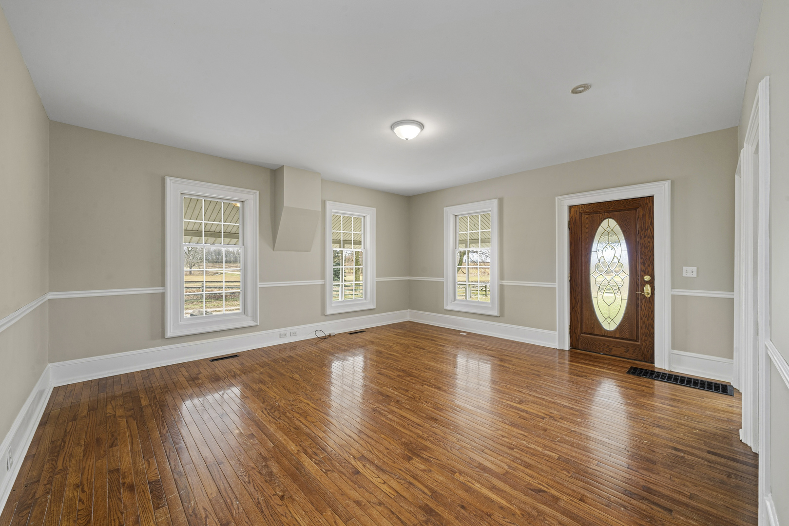 16645 Lasher Road Hinckley, IL 60520 - Photo 8 of 80 a view of empty room with wooden floor and fan
