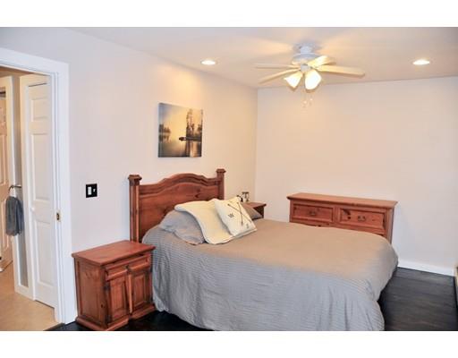 10 Collette Road Sturbridge, MA 01518 - Photo 13 of 30 a bedroom with a bed and wooden floor