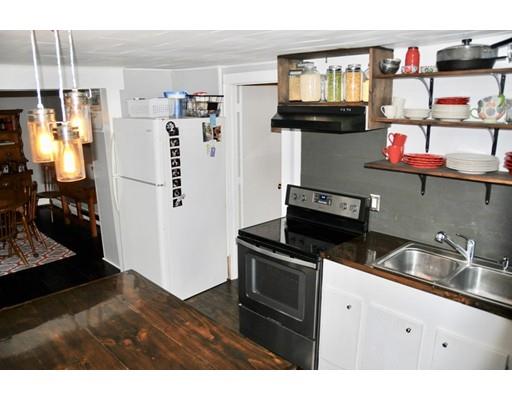 10 Collette Road Sturbridge, MA 01518 - Photo 9 of 30 a kitchen with a refrigerator and a sink