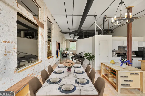 a view of a dining room with furniture window and outside view