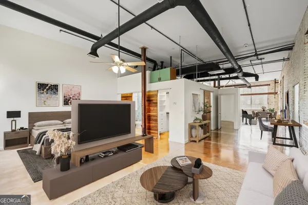 a living room with furniture and a flat screen tv