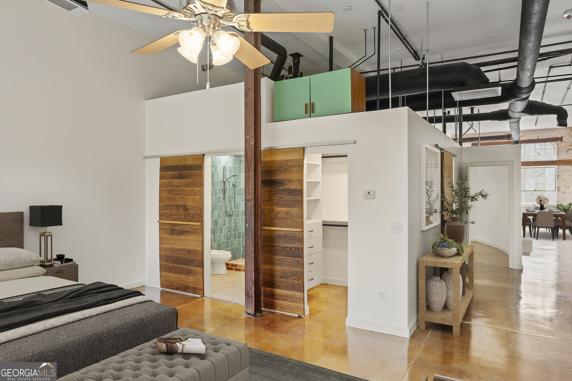 585 White Circle, Unit 509 Athens, GA 30605 - Photo 19 of 42 a bedroom with a bed and wooden floor