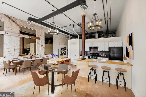 a view of a dining room with furniture window and outside view