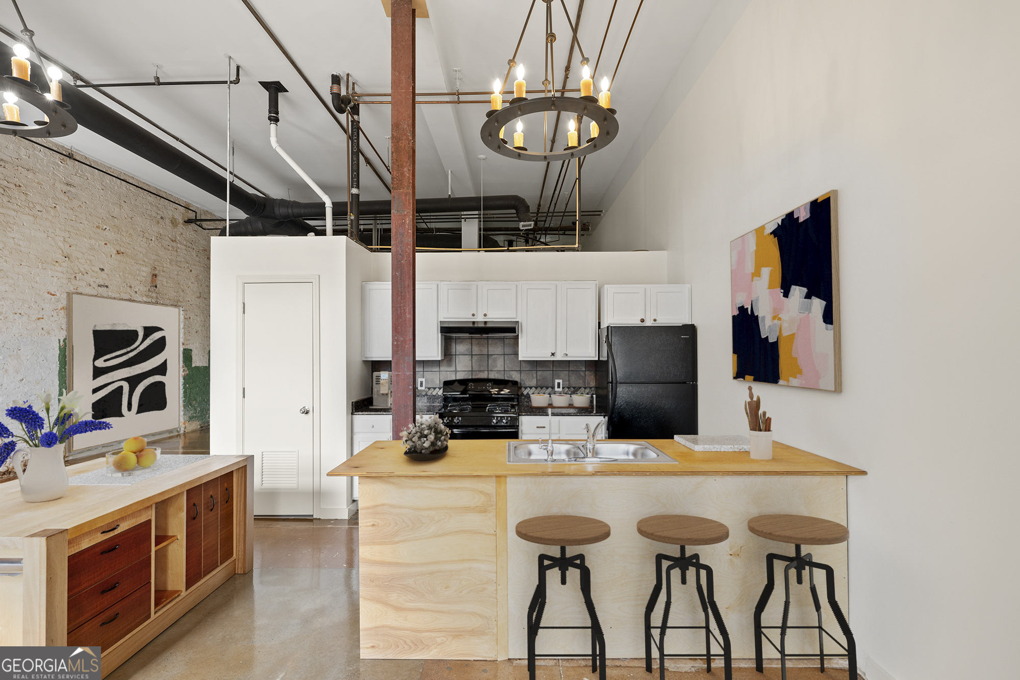 585 White Circle, Unit 509 Athens, GA 30605 - Photo 6 of 42 a kitchen with stainless steel appliances kitchen island granite countertop a table chairs in it and white cabinets