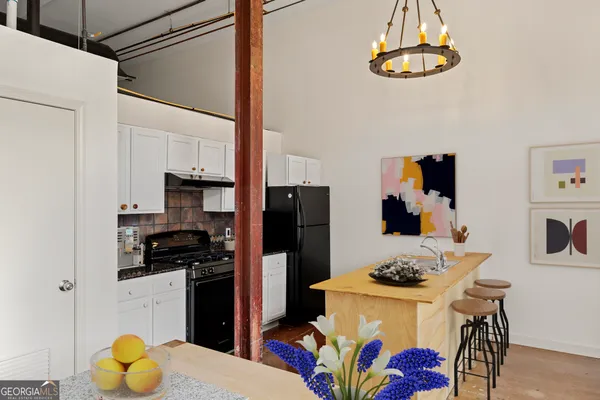 a living room with furniture and flat screen tv