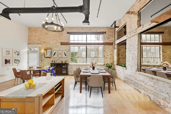 a view of a dining room with furniture window and outside view