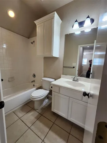 a bathroom with a sink a toilet and bathtub