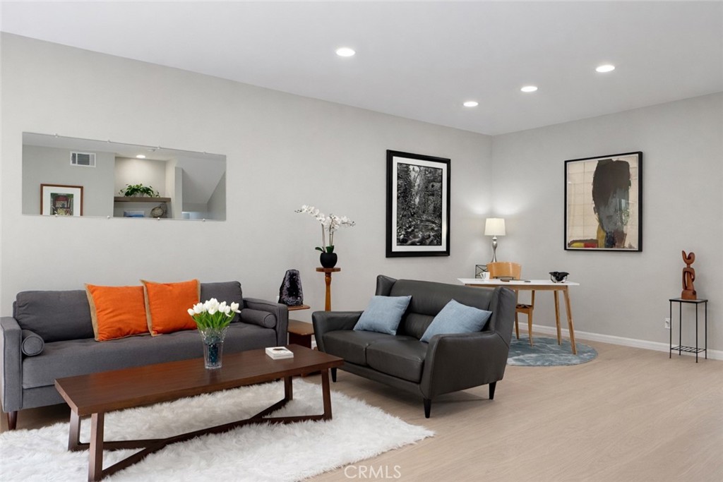 1108 18th Street, Unit 7 Santa Monica, CA 90403 - Photo 1 of 26 a living room with furniture and a couch